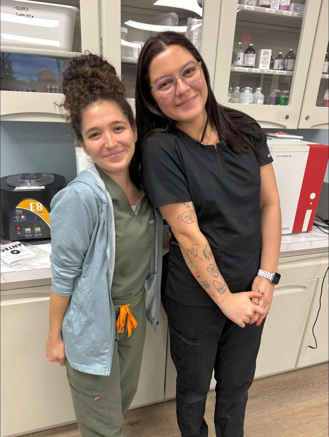 Two Staff Members Smiling